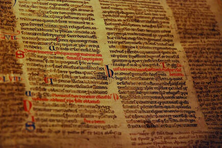 Medieval manuscript page with black and red text